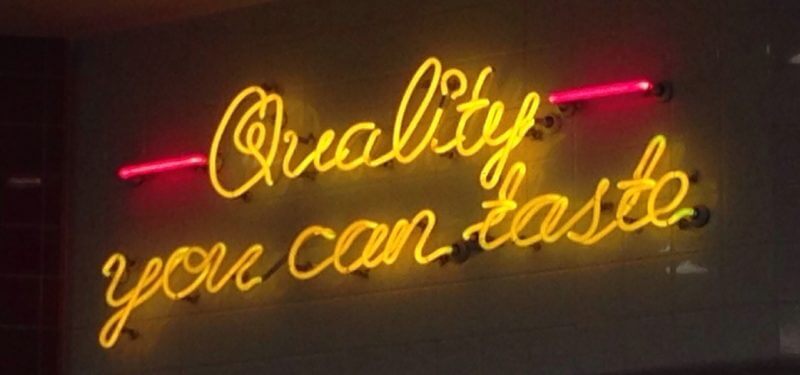 Neon sign saying, 