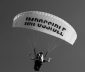 White parachute with impossible written in black upon the canopy